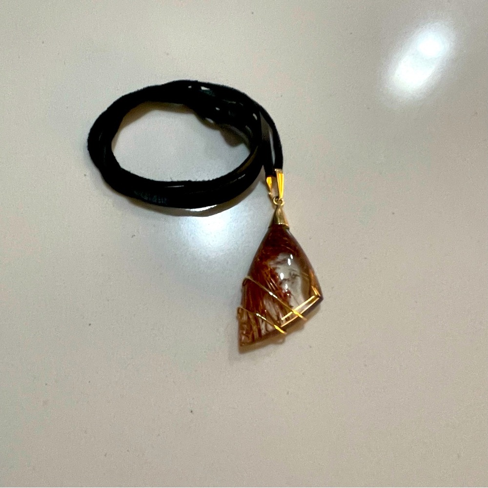 One of A Kind Rutilated Quartz Free form pendant wrapped in 14kt. Yellow gold